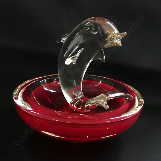 An Italian glass sommerso bowl with central sculpture of a tail standing dolphin